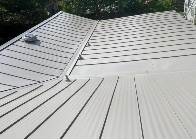 Solar attic fan installed on a metal roof for Roof Ventilation in Colusa